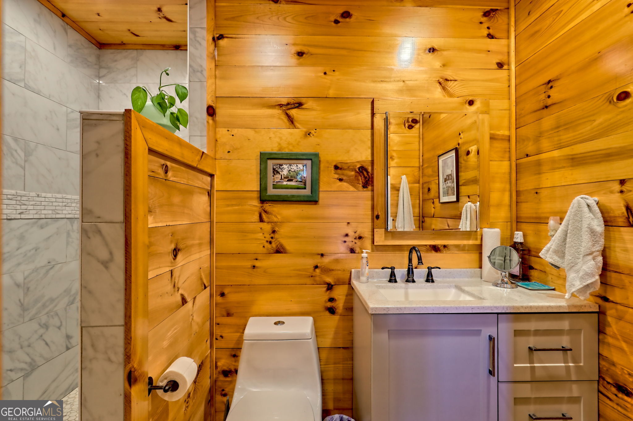 557 Walnut Grove Lane Tiger, GA 30576 - Photo 20 of 75 a bathroom with a sink and a mirror