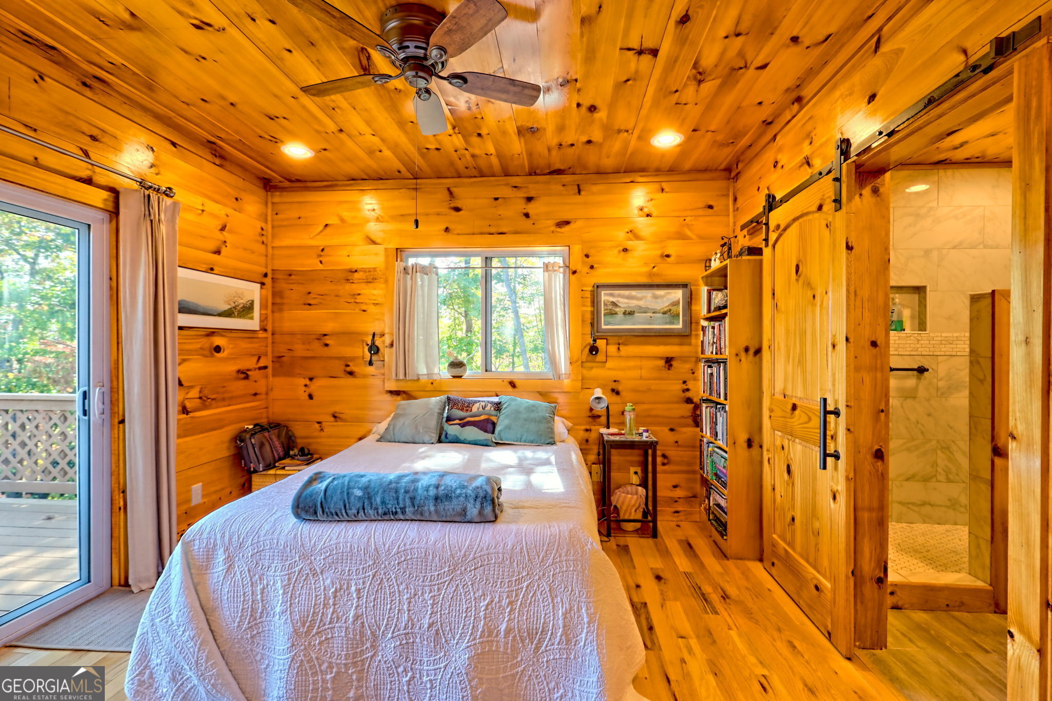 557 Walnut Grove Lane Tiger, GA 30576 - Photo 38 of 75 a bedroom with a bed and wooden floor