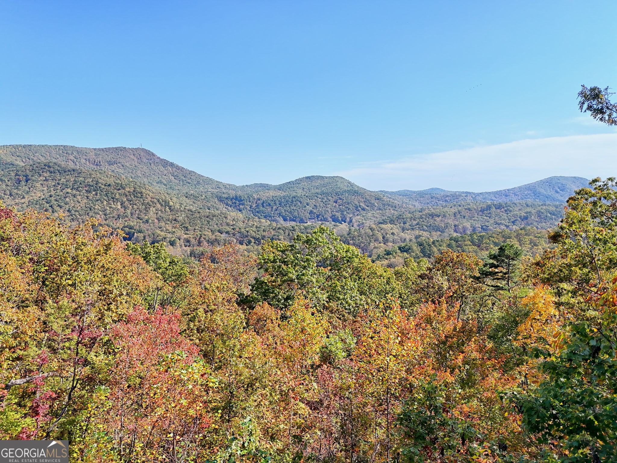 557 Walnut Grove Lane Tiger, GA 30576 - Photo 4 of 75 a view of a mountain range in a cloudy sky