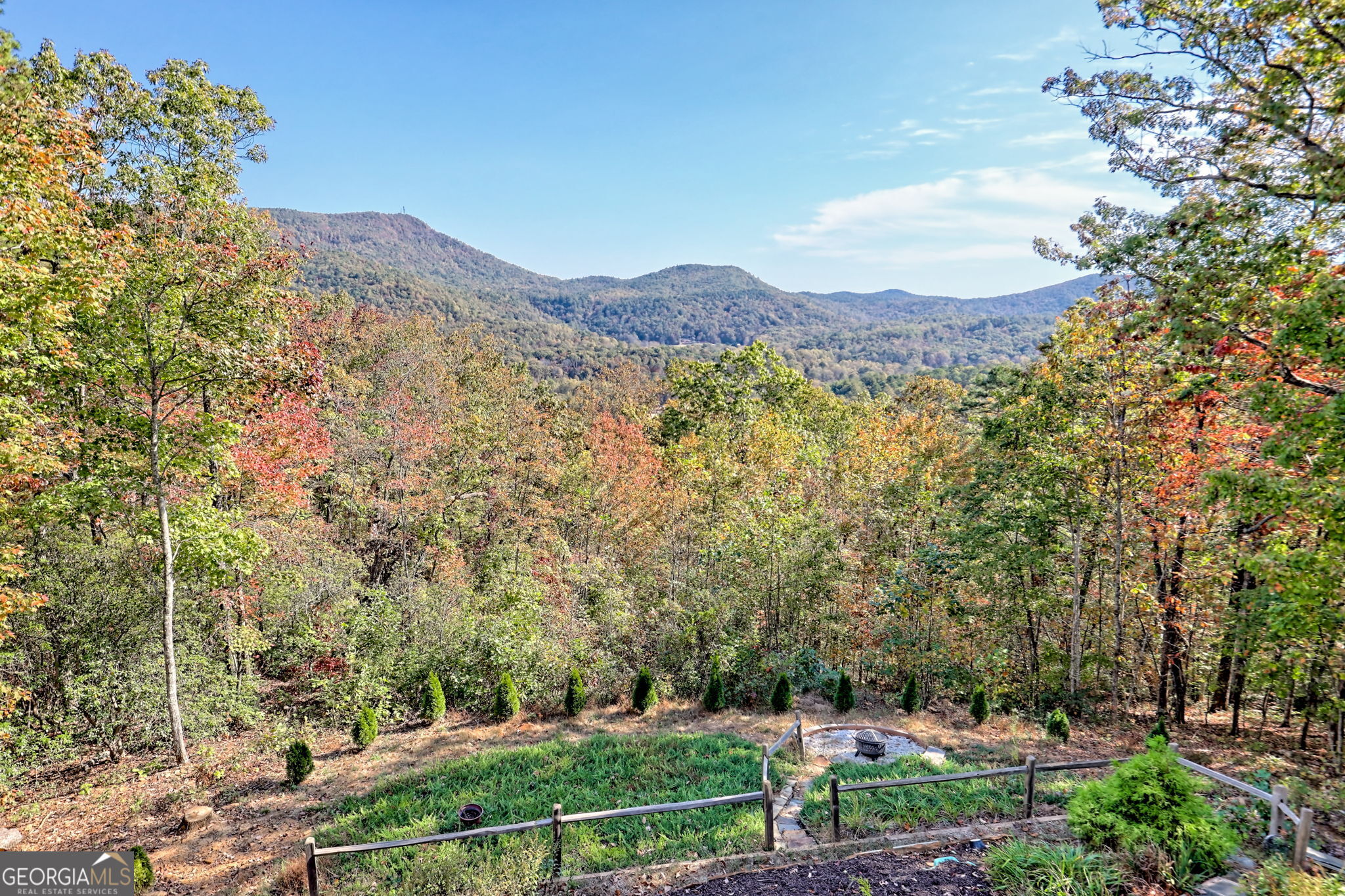 557 Walnut Grove Lane Tiger, GA 30576 - Photo 56 of 75 a view of a lush green field with mountains in the background