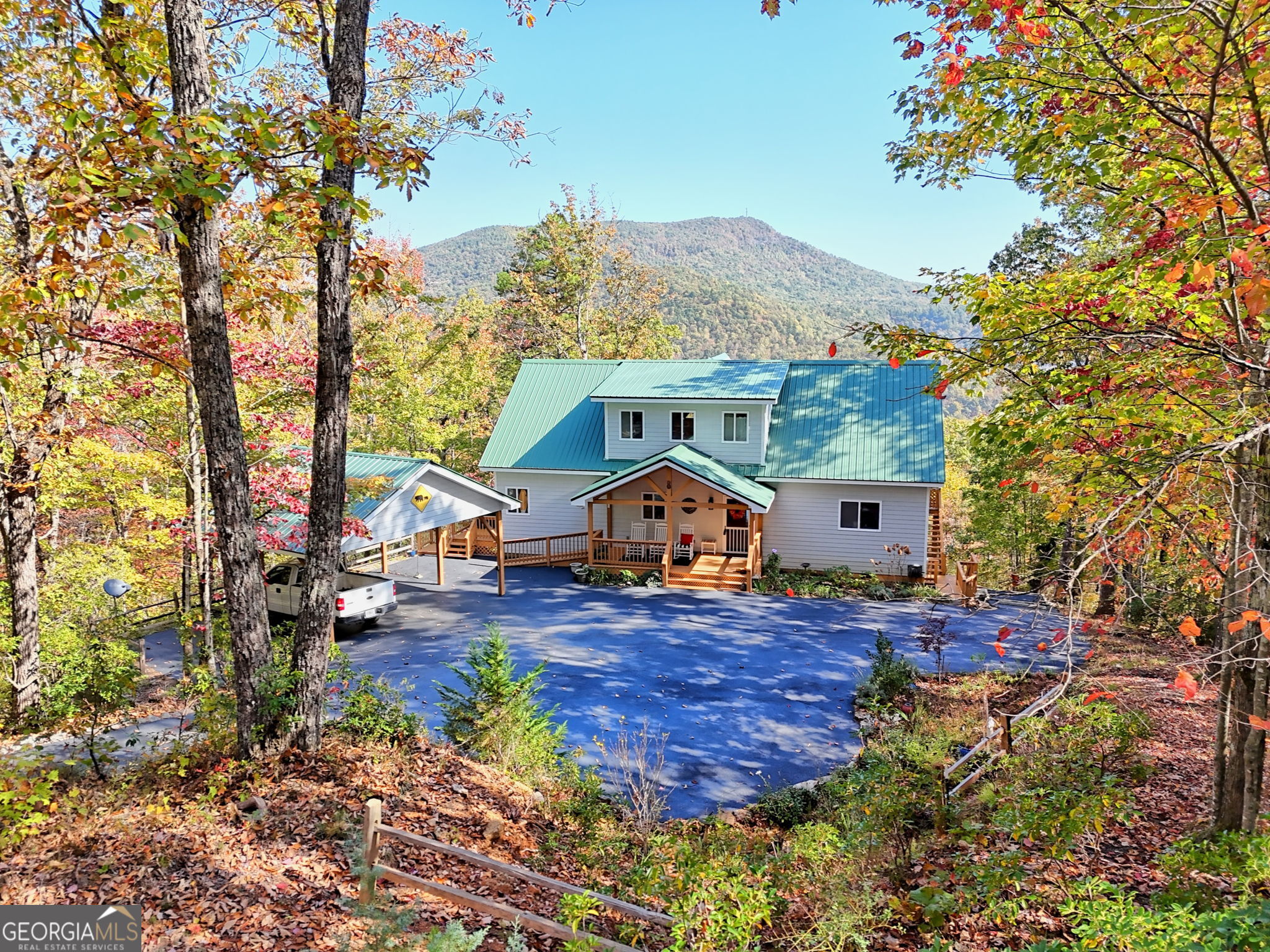 557 Walnut Grove Lane Tiger, GA 30576 - Photo 63 of 75 a front view of a house with a yard and mountain view