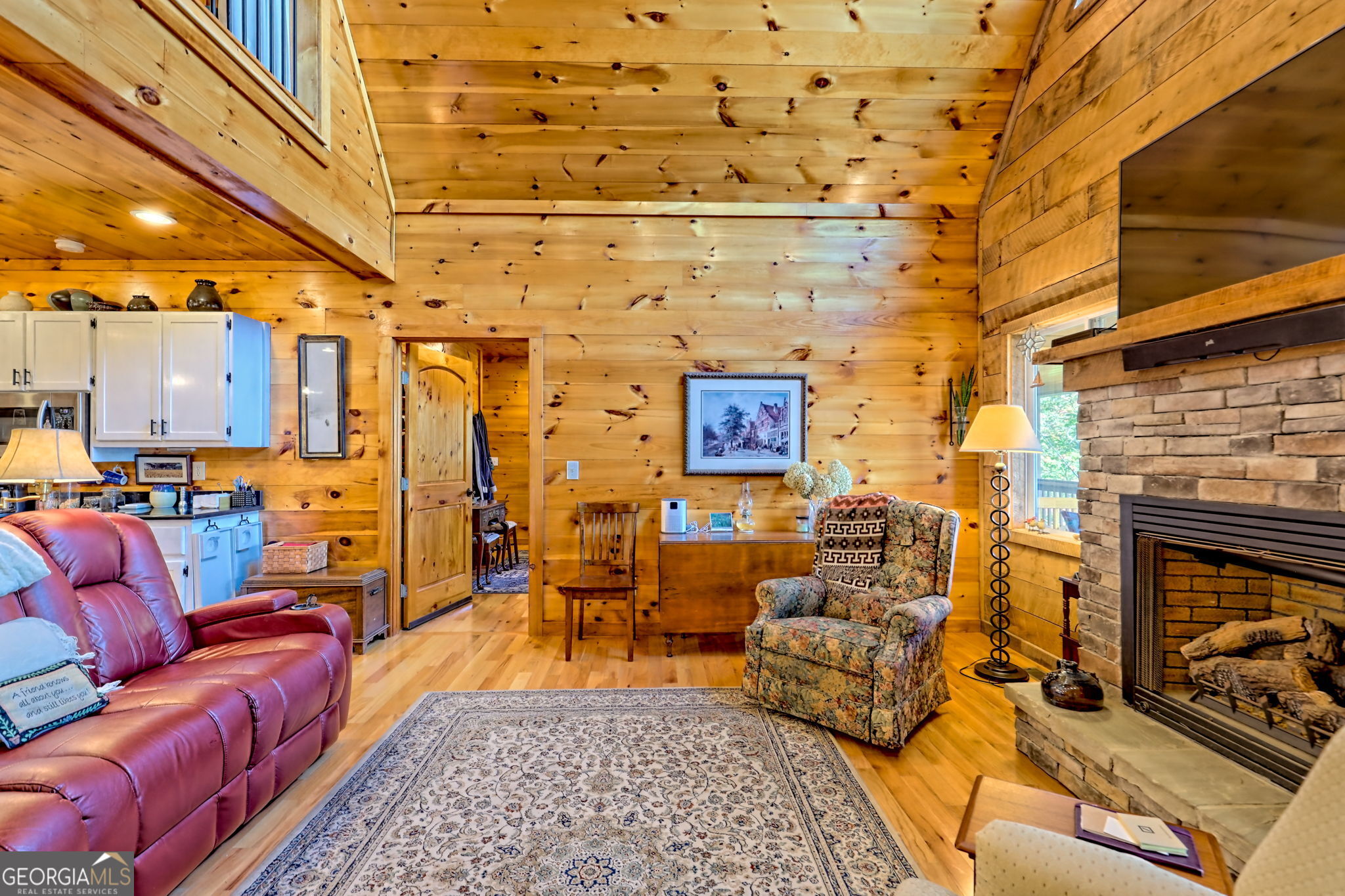 557 Walnut Grove Lane Tiger, GA 30576 - Photo 8 of 75 a living room with furniture and a fireplace