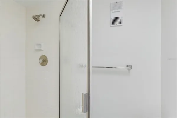 an empty room with large windows