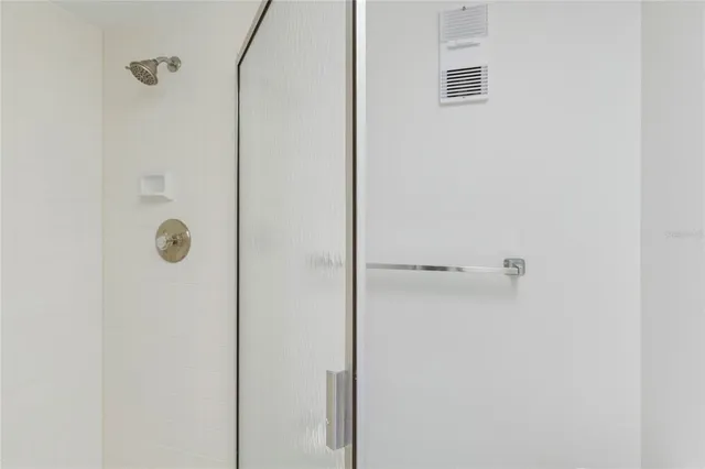 an empty room with large windows