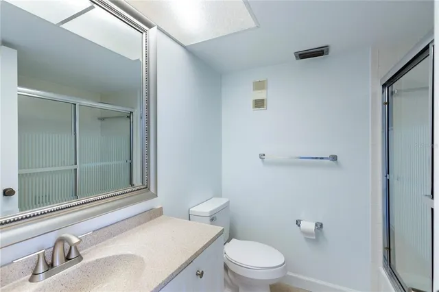 a view of an empty room and a bathroom