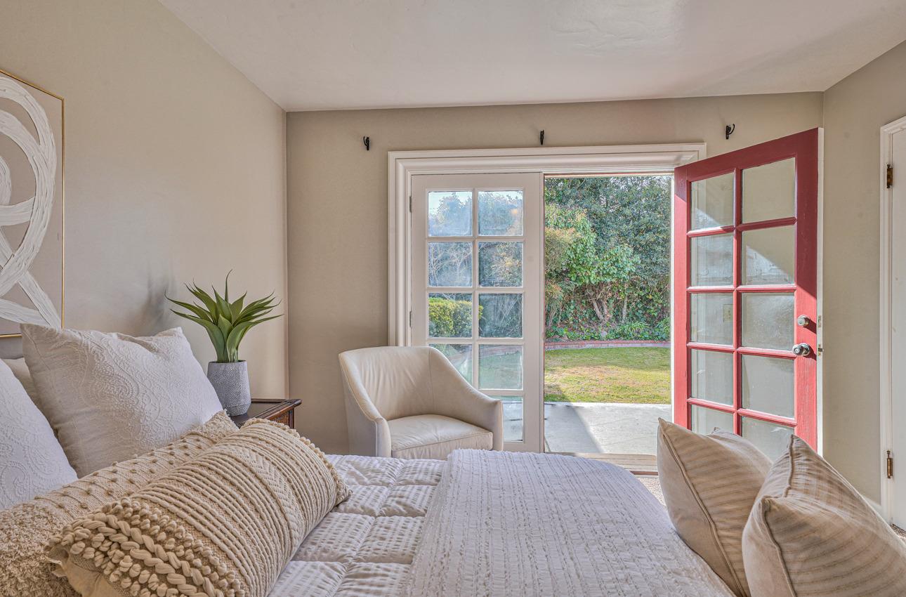 402 Lorimer Street Salinas, CA 93901 - Photo 18 of 36 a bedroom with a large bed and a large window with outer view