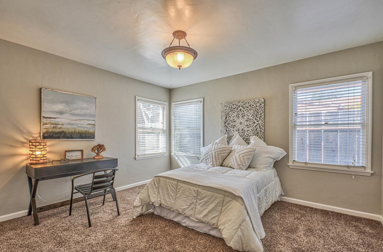 402 Lorimer Street Salinas, CA 93901 - Photo 21 of 36 a bedroom with a bed and a window