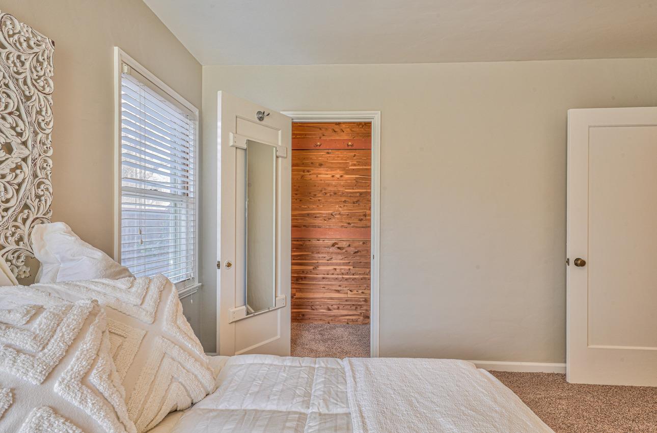 402 Lorimer Street Salinas, CA 93901 - Photo 22 of 36 a bedroom with a bed and wooden floor