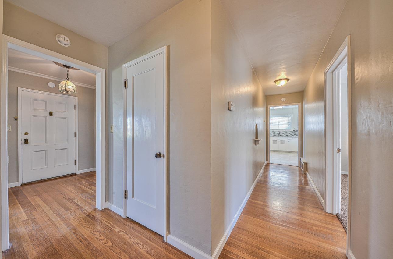 402 Lorimer Street Salinas, CA 93901 - Photo 24 of 36 a view of a hallway with wooden floor
