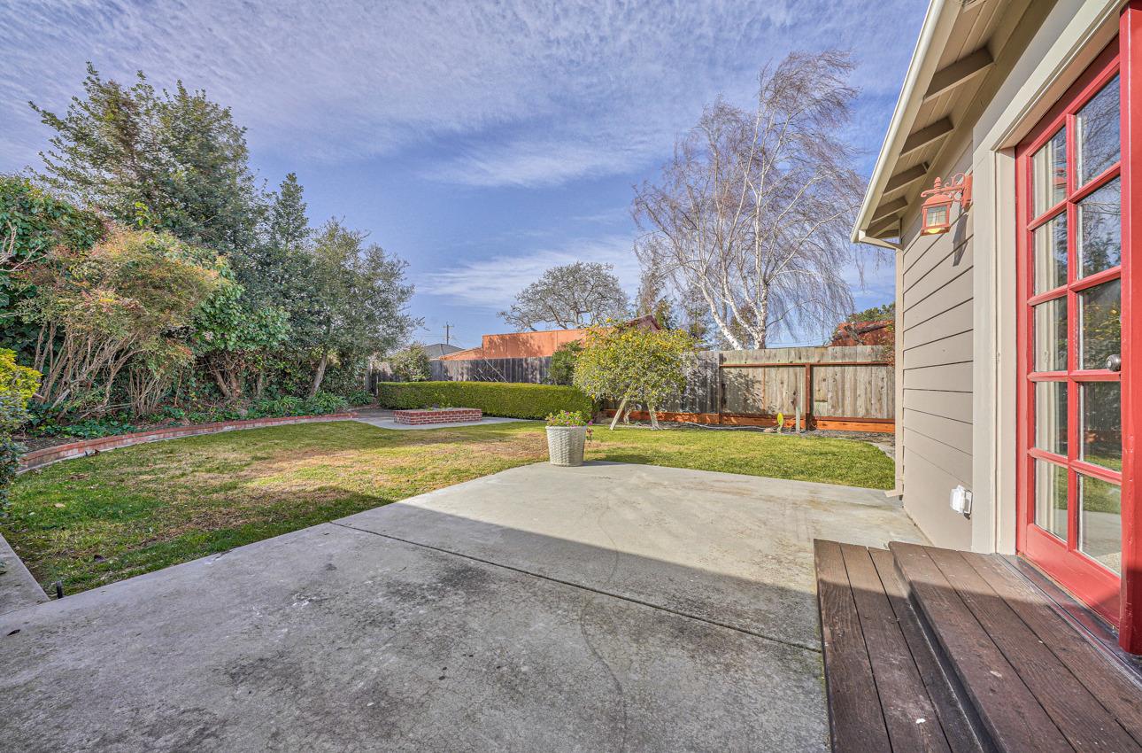 402 Lorimer Street Salinas, CA 93901 - Photo 33 of 36 a view of yard with swimming pool outdoor seating and trees in the background