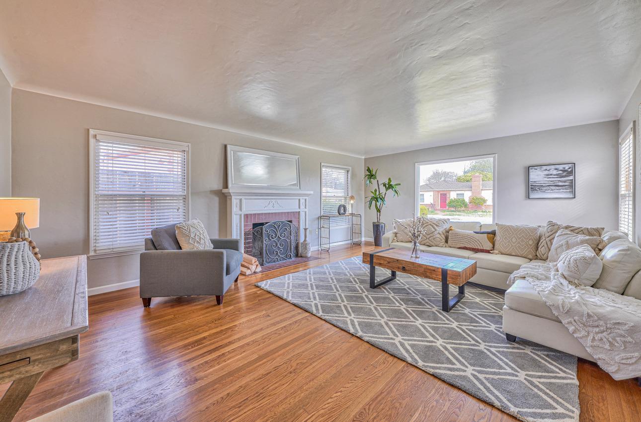 402 Lorimer Street Salinas, CA 93901 - Photo 5 of 36 a living room with furniture and a fireplace