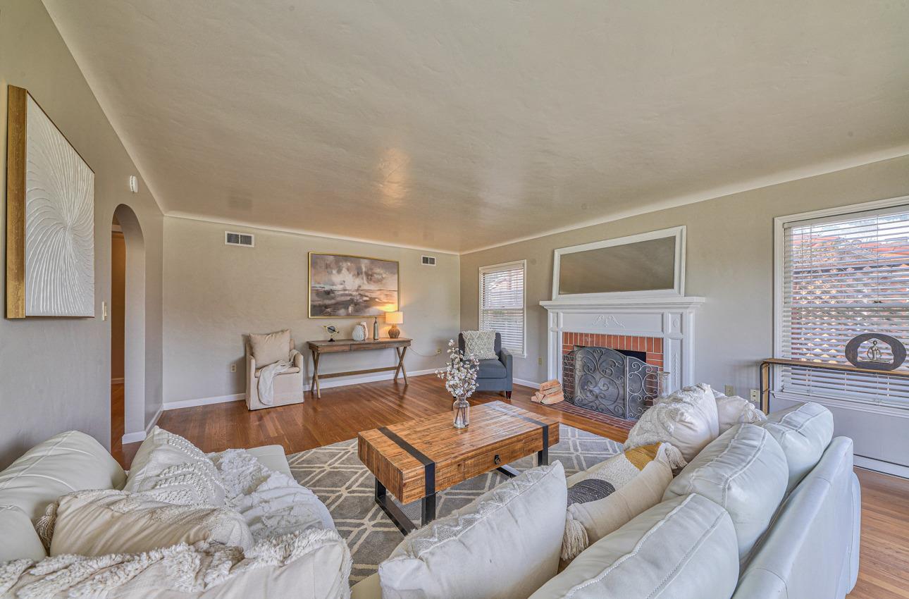 402 Lorimer Street Salinas, CA 93901 - Photo 7 of 36 a living room with furniture and a fireplace