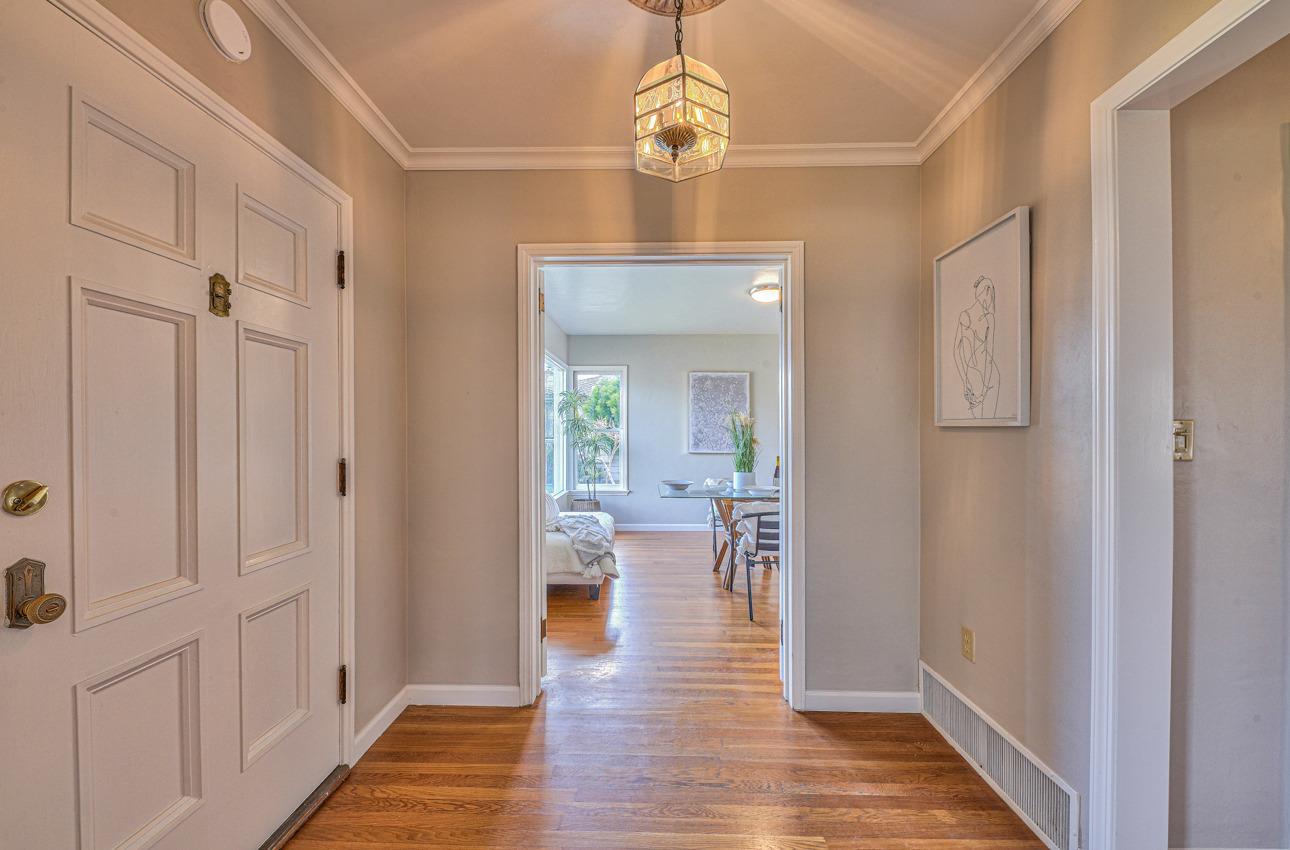 402 Lorimer Street Salinas, CA 93901 - Photo 8 of 36 a view of a hallway with wooden floor and staircase