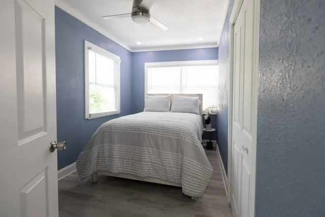 a bedroom with a bed and window