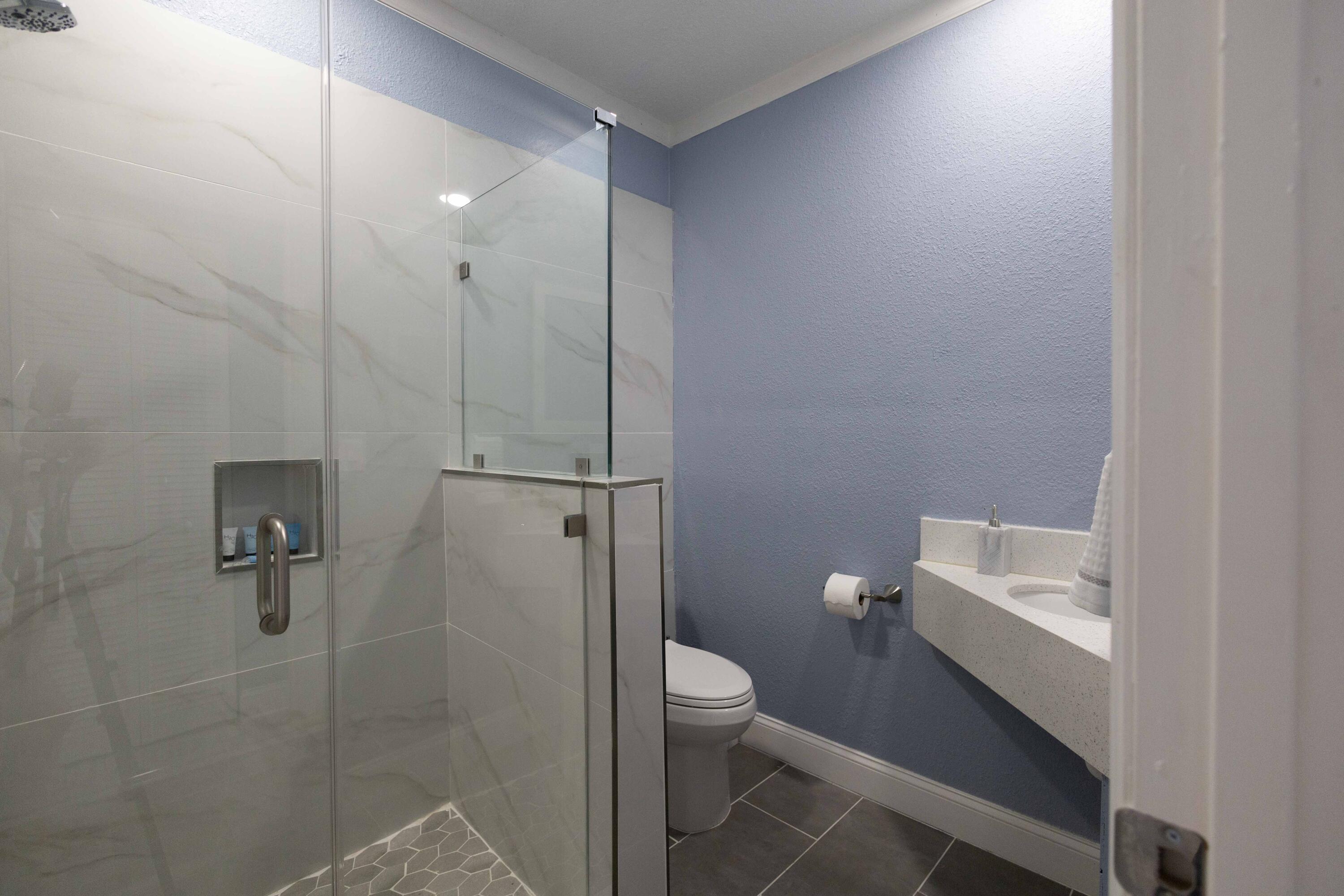 420 Avenida Alegre, Unit 4 West Palm Beach, FL 33405 - Photo 15 of 33 a bathroom with a toilet sink and shower