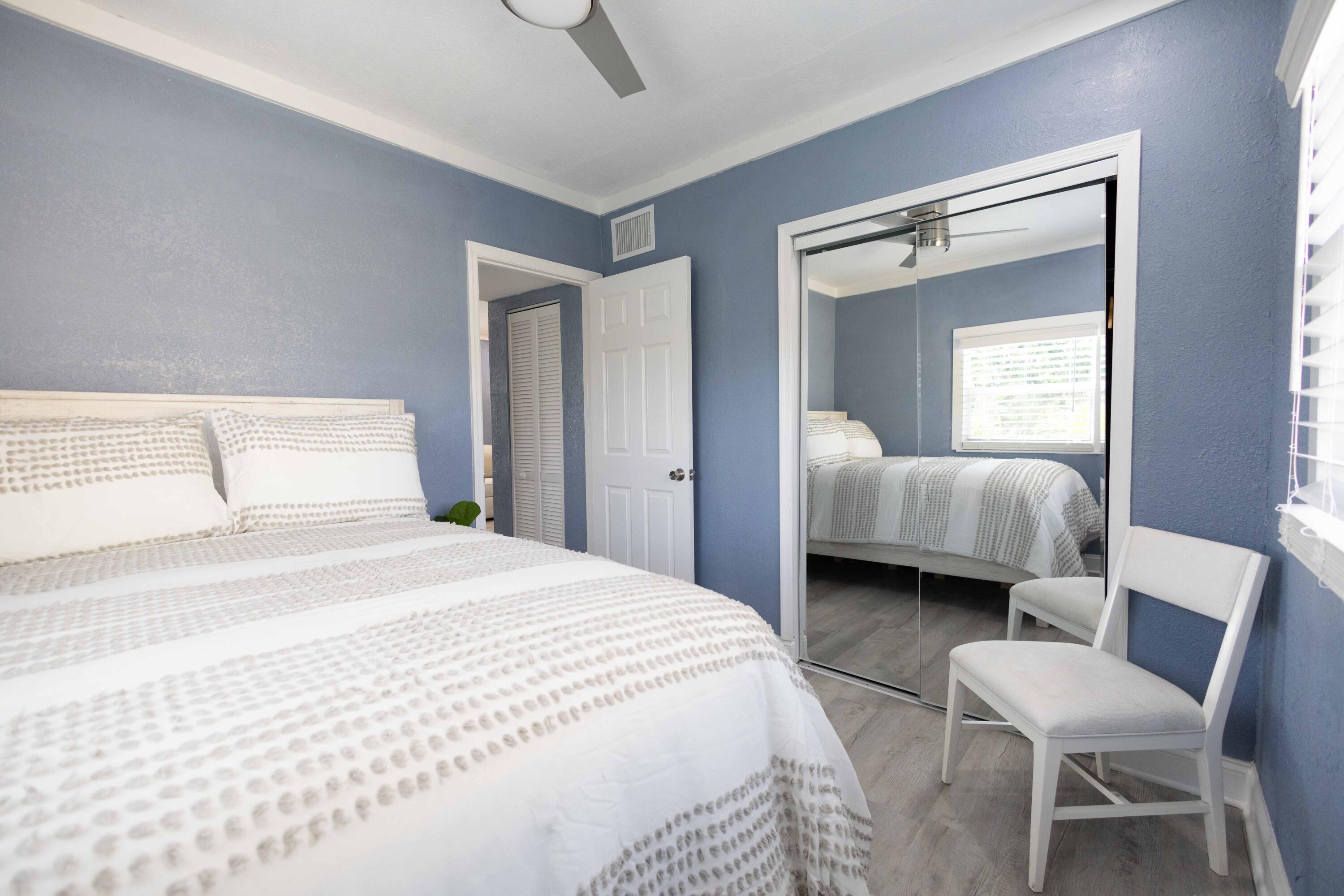 420 Avenida Alegre, Unit 4 West Palm Beach, FL 33405 - Photo 18 of 33 a bedroom with a bed and a chair