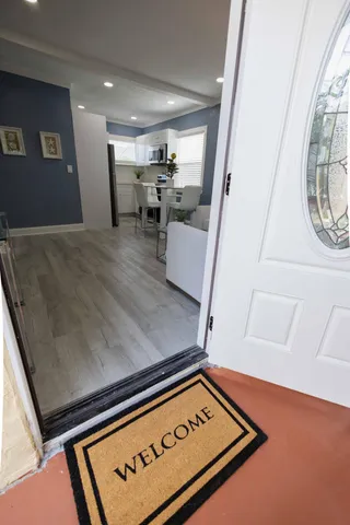 a view of kitchen with furniture and staircase