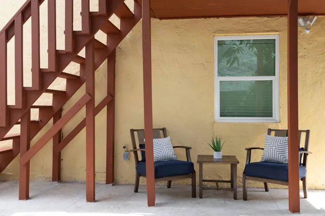 a view of a chairs and table in a room