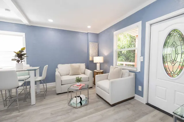 a living room with furniture and a window