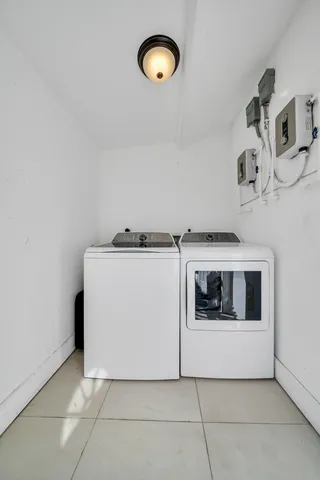 a utility room with washer and dryer