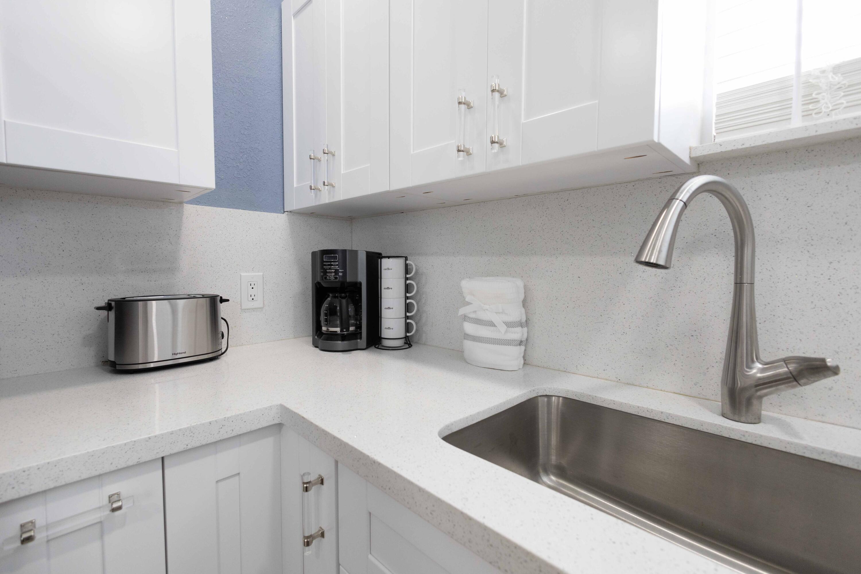 420 Avenida Alegre, Unit 4 West Palm Beach, FL 33405 - Photo 10 of 33 a kitchen with a sink and cabinets