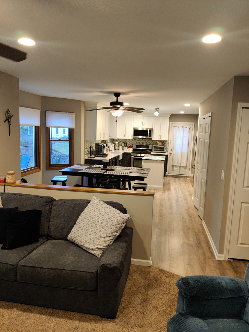 1681 Boulder Ridge Drive Bolingbrook, IL 60490 - Photo 10 of 17 a living room with stainless steel appliances kitchen island granite countertop furniture and a view of kitchen