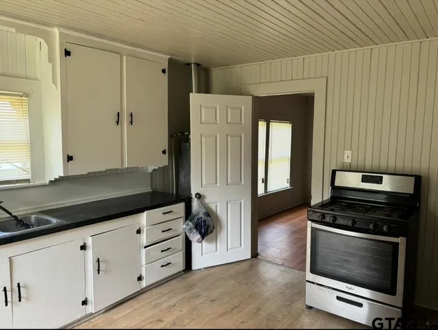 a kitchen with appliances and cabinets