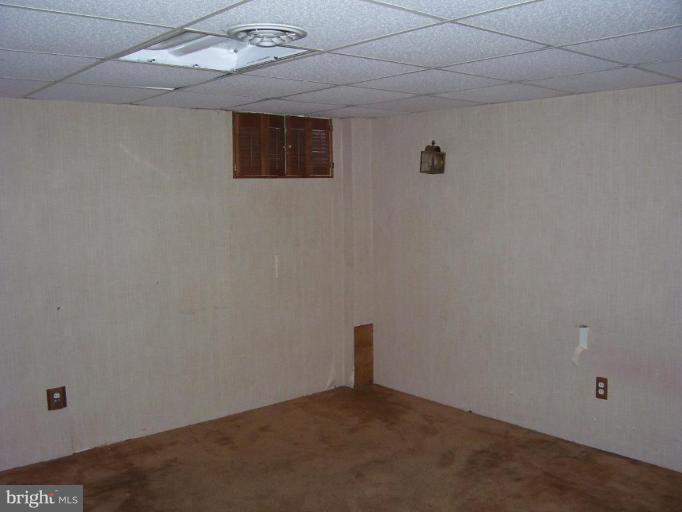 5464 Whitlock Road Baltimore, MD 21229 - Photo 6 of 6 a view of an empty room with a window