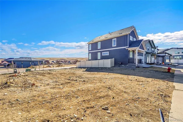 a view of residential houses with ocean view