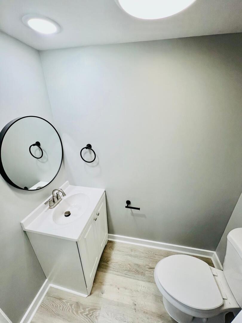 2021 Farnham Court Schaumburg, IL 60169 - Photo 8 of 16 a bathroom with a toilet a sink and mirror