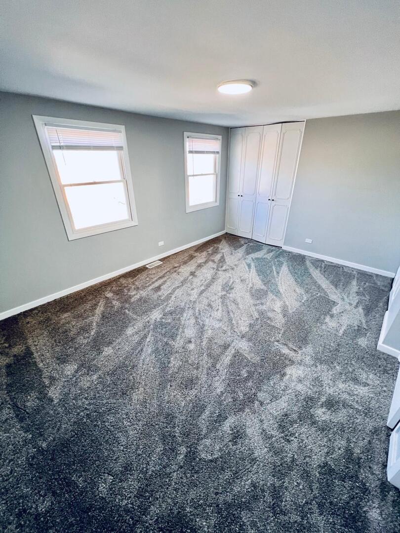 2021 Farnham Court Schaumburg, IL 60169 - Photo 9 of 16 a view of empty room with windows