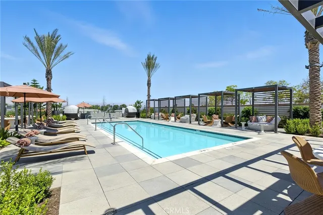 a view of swimming pool with outdoor seating and a terrace