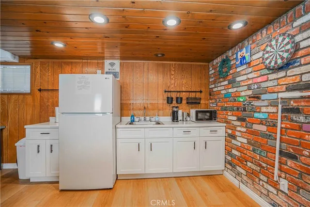 a view of a livingroom with furniture and flat screen tv