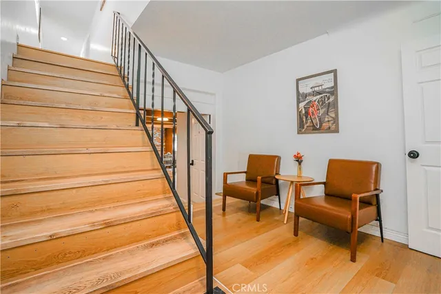 a living room with stainless steel appliances kitchen island granite countertop furniture and a kitchen view