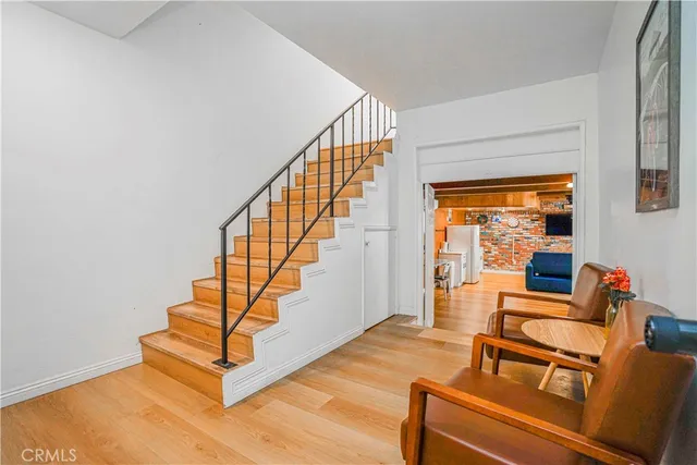 a bedroom with a large bed and a chair