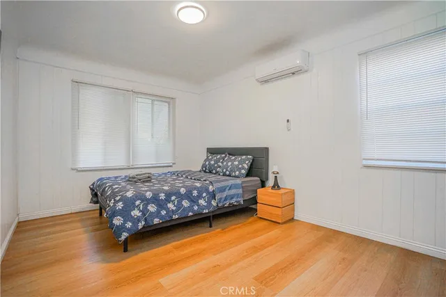 a bathroom with a shower sink and mirror
