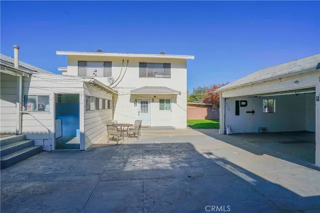 a view of a house with a yard and garage