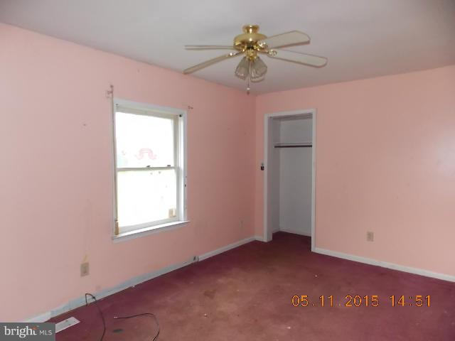 15745 Pratt Road Ridge, MD 20680 - Photo 10 of 12 a view of an empty room with a window