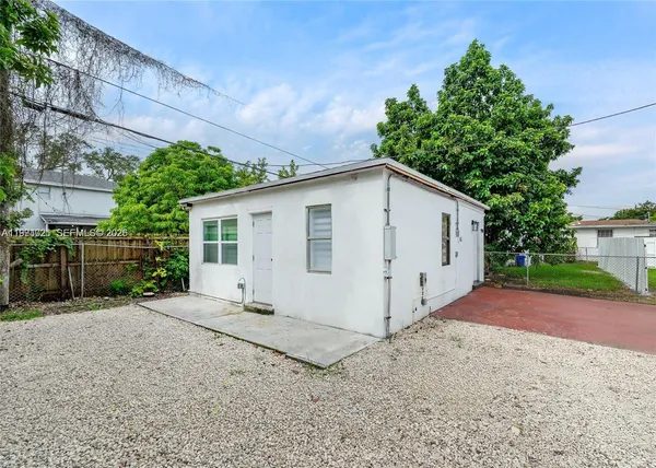 a view of a house with a yard and garage