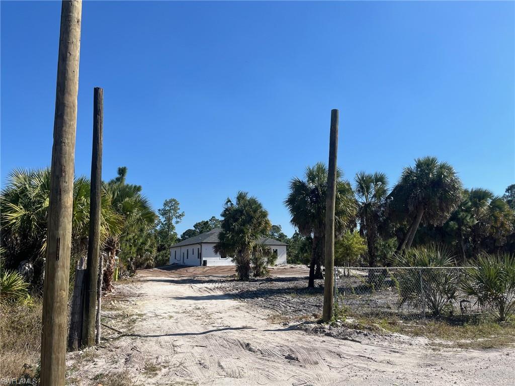 Dove Tree Street Naples, FL 34117 - Photo 4 of 13 Home under construction next door