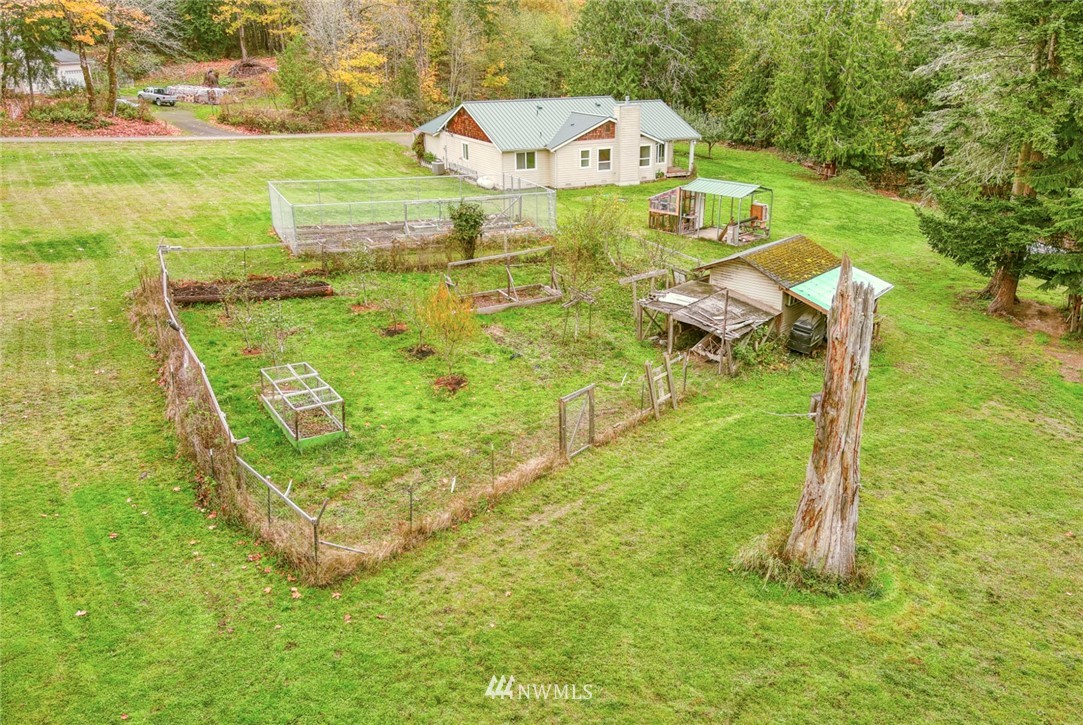 384 Sugar Hill Road Port Hadlock, WA 98339 - Photo 5 of 36 a view of swimming pool with a garden and seating area