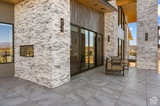 3652 South Cypress Road Hurricane, UT 84737 - Photo 48 of 81 Expansive outdoor patio featuring large format tile flooring and a built-in outdoor fireplace