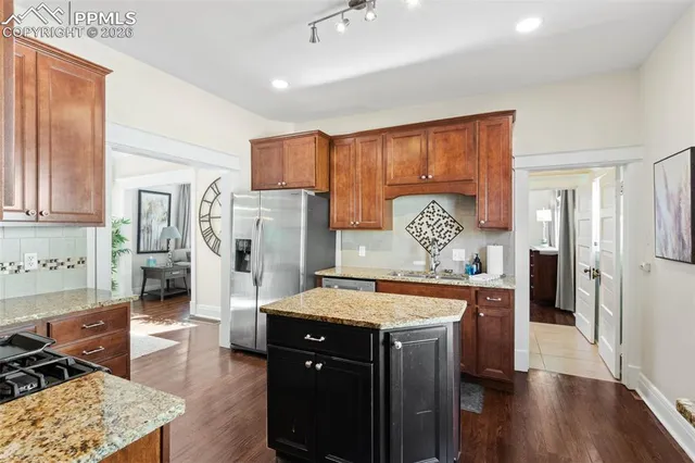 a room with a table chairs and entryway
