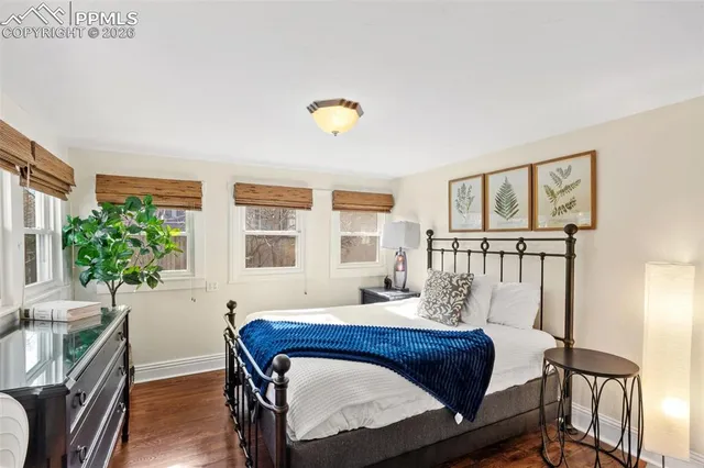 a bedroom with furniture and a window