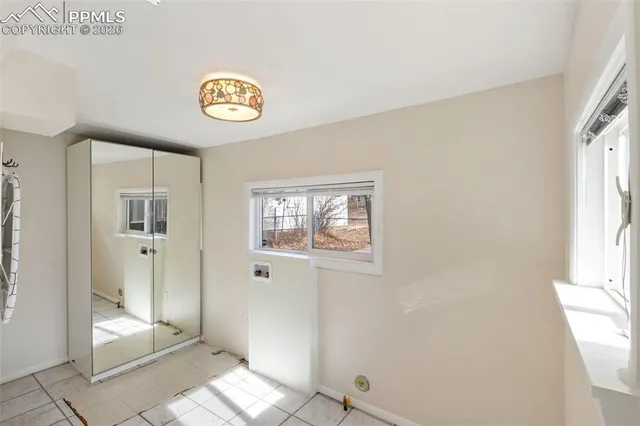 a view of an entryway with wooden floor