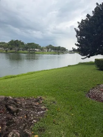 a view of a lake with houses in the back