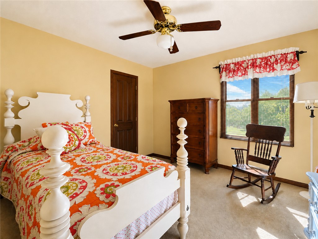 222 Terrace Drive Anderson, SC 29621 - Photo 21 of 37 Well-lit sleeping quarters with a ceiling fan, a window, and soft carpeting.