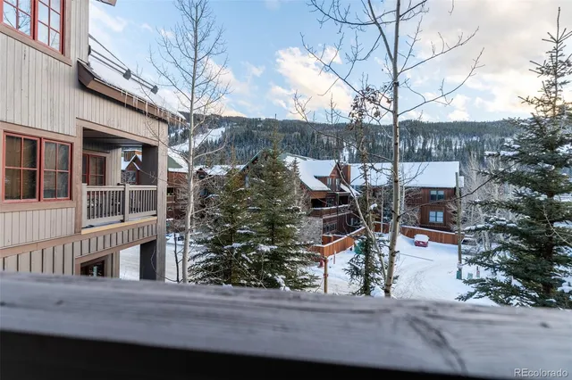 a view of a house with a tree