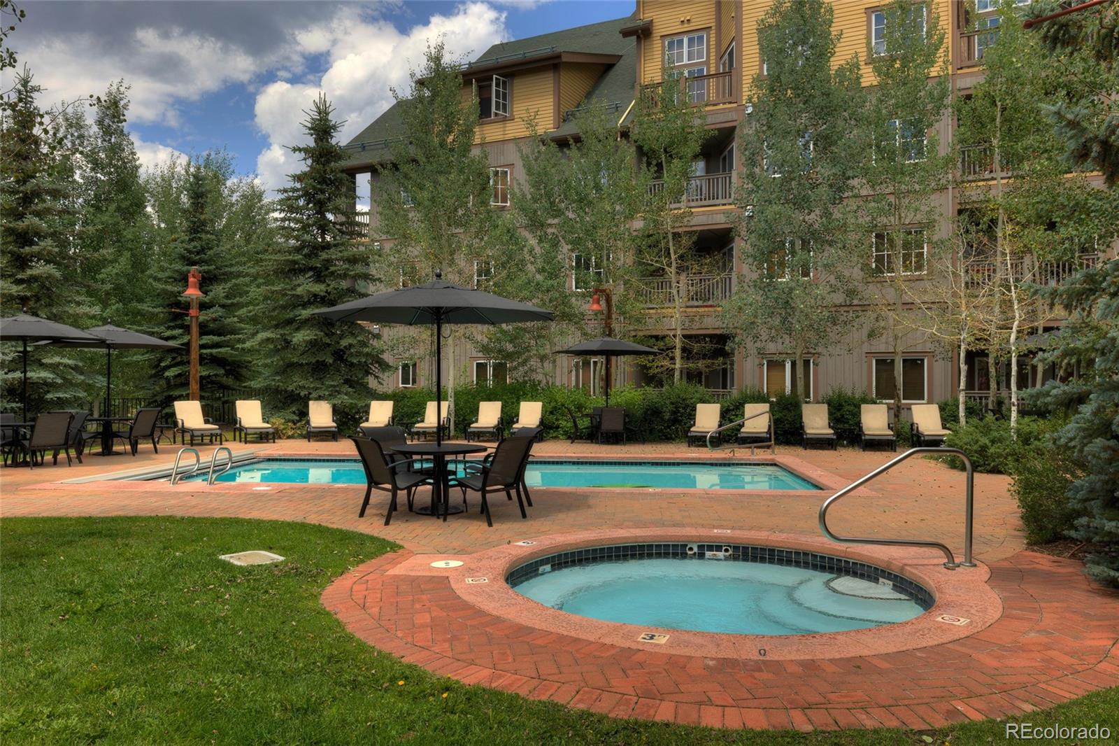 135 Dercum Drive, Unit 8595 Keystone, CO 80435 - Photo 24 of 33 swimming pool view with a seating space and a garden
