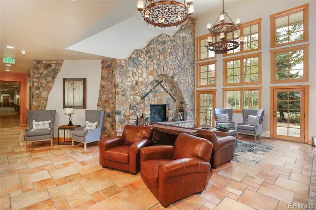 a view of a chair and table in backyard of the house